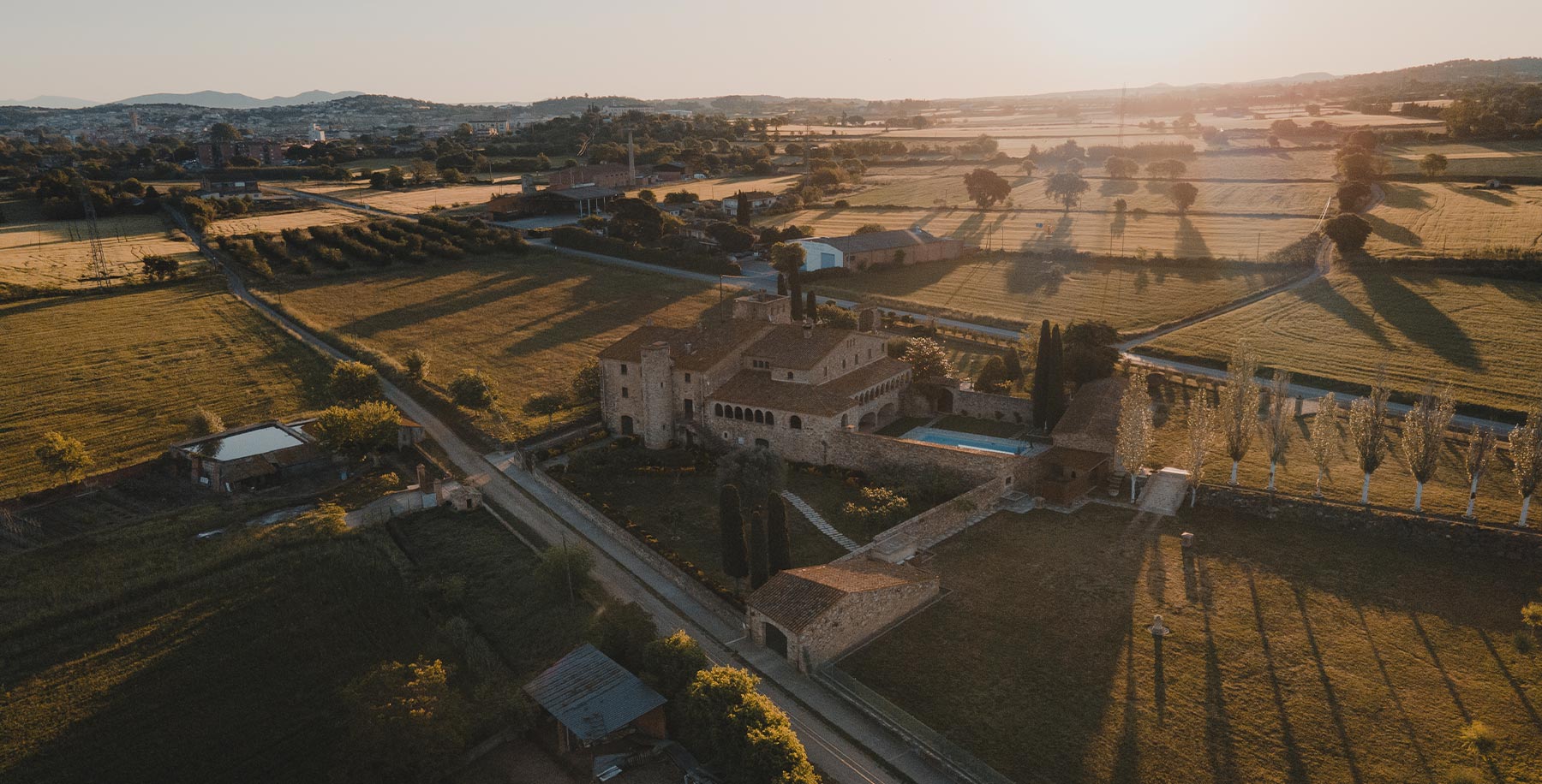 Aerial view of Mas Sendra and the Empordà fields at sunrise